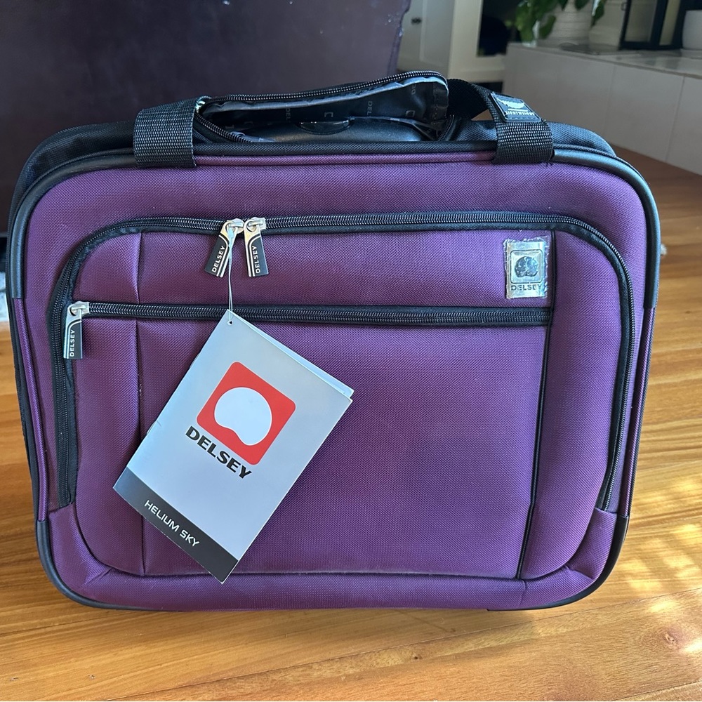 Delsey Helium Sky rolling carry on suitcase trolley tote